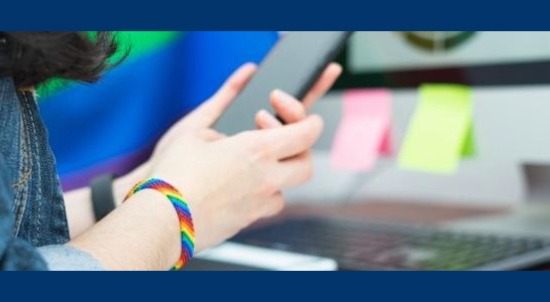 Image of LGBTQ student with rainbow bracelet