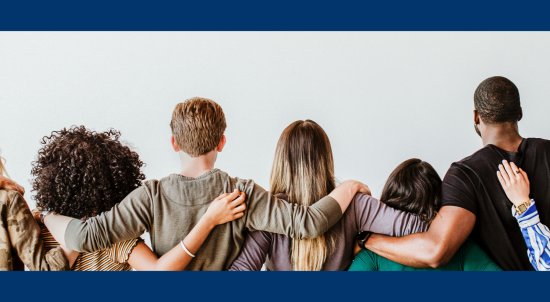 Diverse group of people with their arms around each other