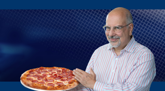 Instructor of Introduction to Negotiation with a pizza