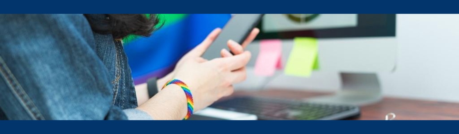 Image of LGBTQ student with rainbow bracelet