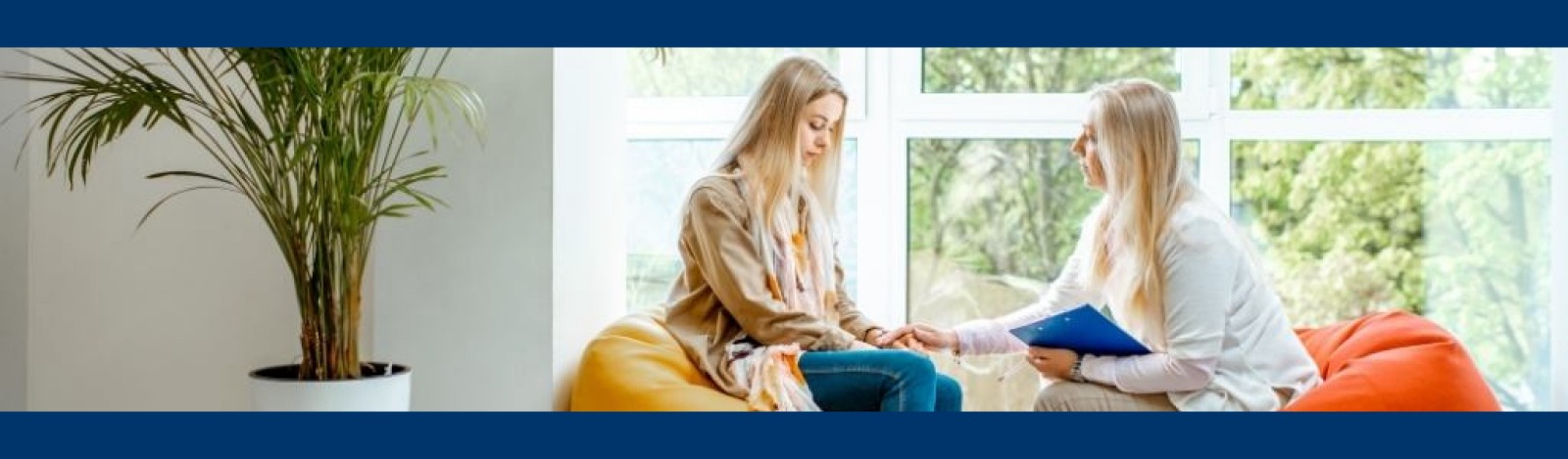 Young woman speaking with a counselor 