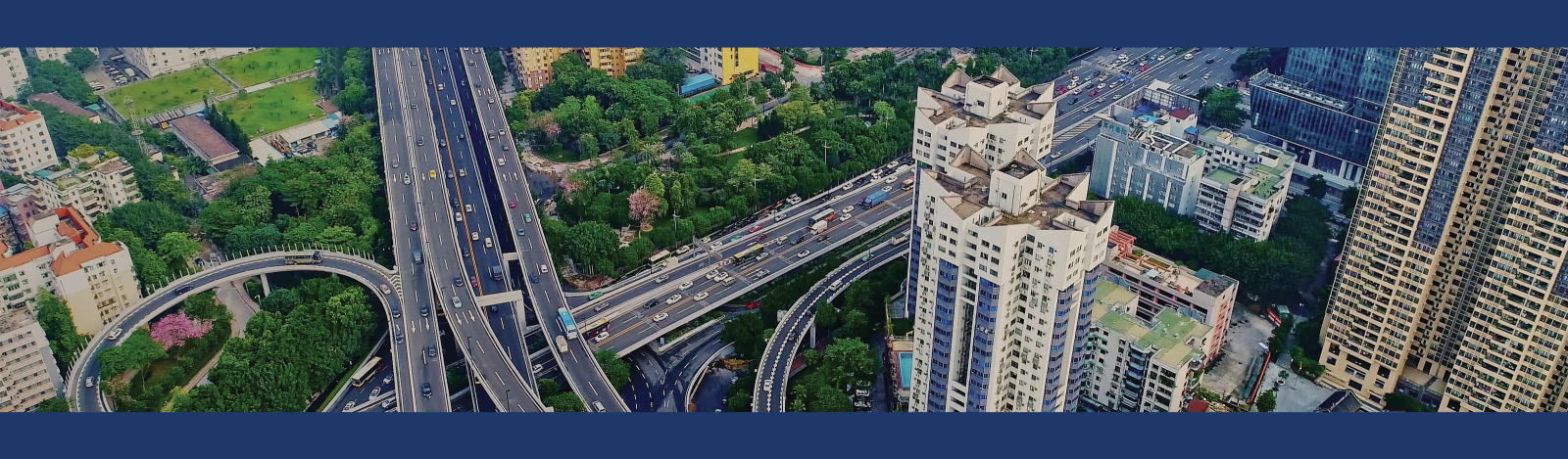 Picture of city from aerial view with highways and skyscrapers.