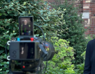 Marla Geha filming course promo outside. 
