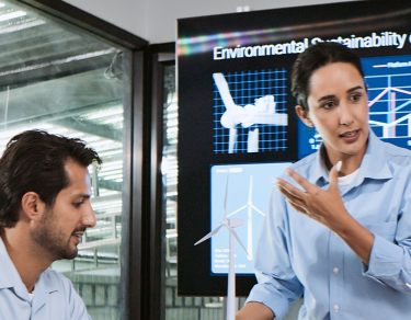Environmentalists in a meeting with presentation on screen.